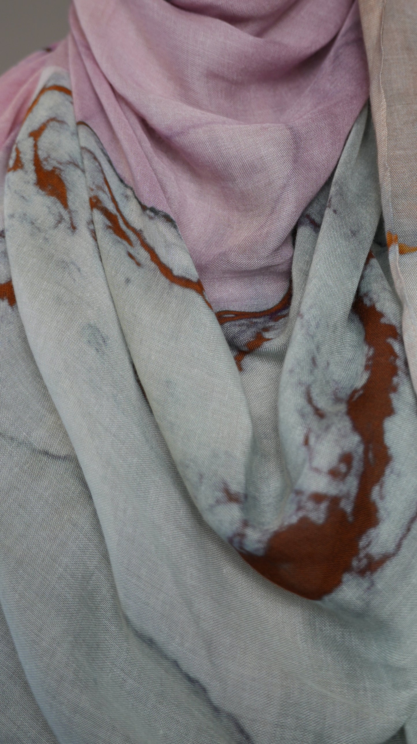 Detailed texture of Rose Marble chiffon hijab fabric showing copper and grey veining
