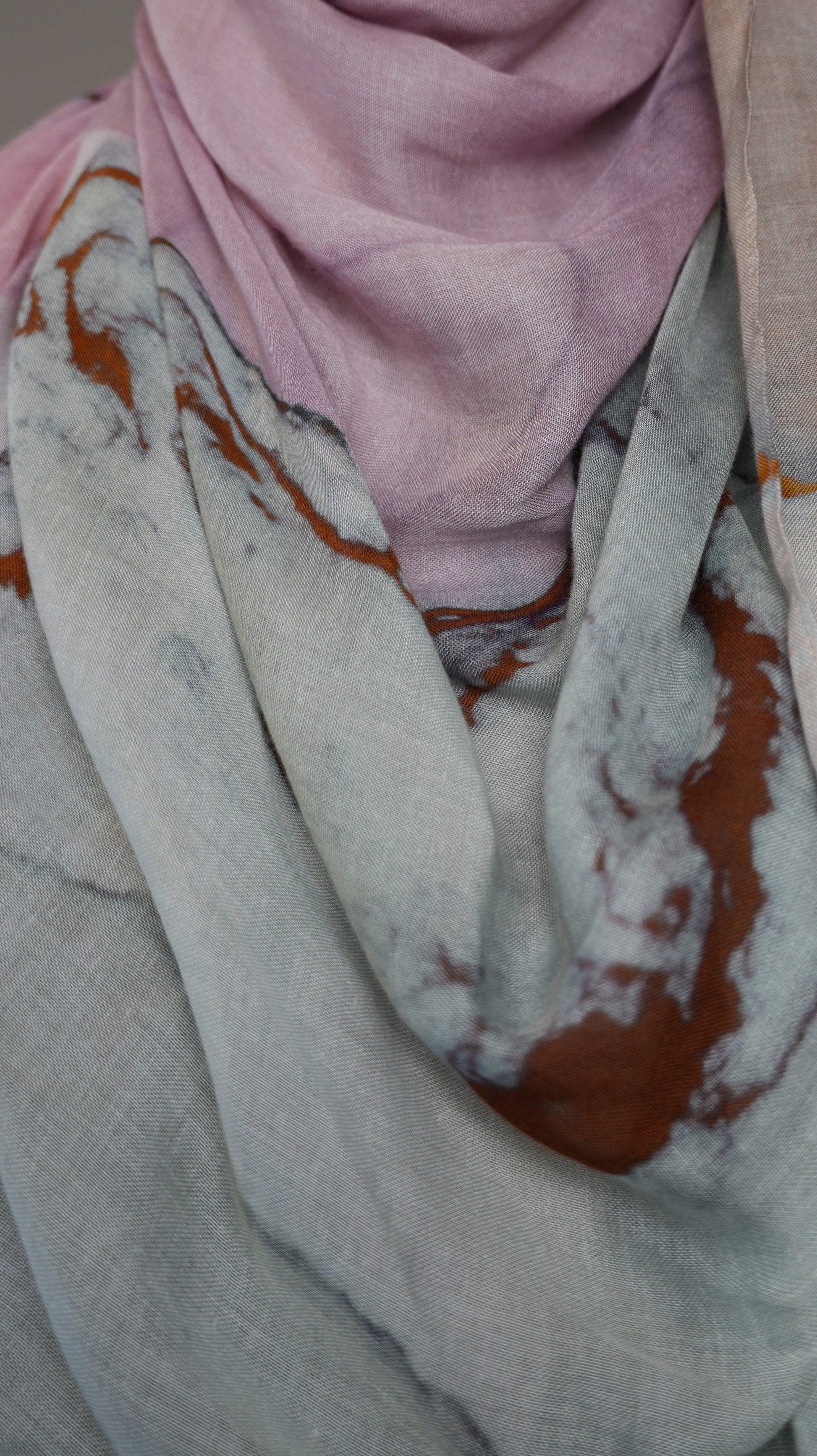 Detailed texture of Rose Marble chiffon hijab fabric showing copper and grey veining