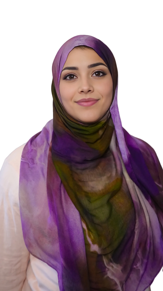 Woman wearing a premium printed modal hijab in a purple and olive watercolor abstract pattern from MyaHijabs